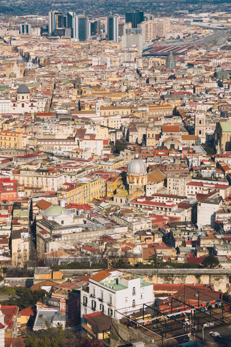 Explore the intricate cityscape of Naples, Italy, with this stunning aerial view showcasing its historic architecture.