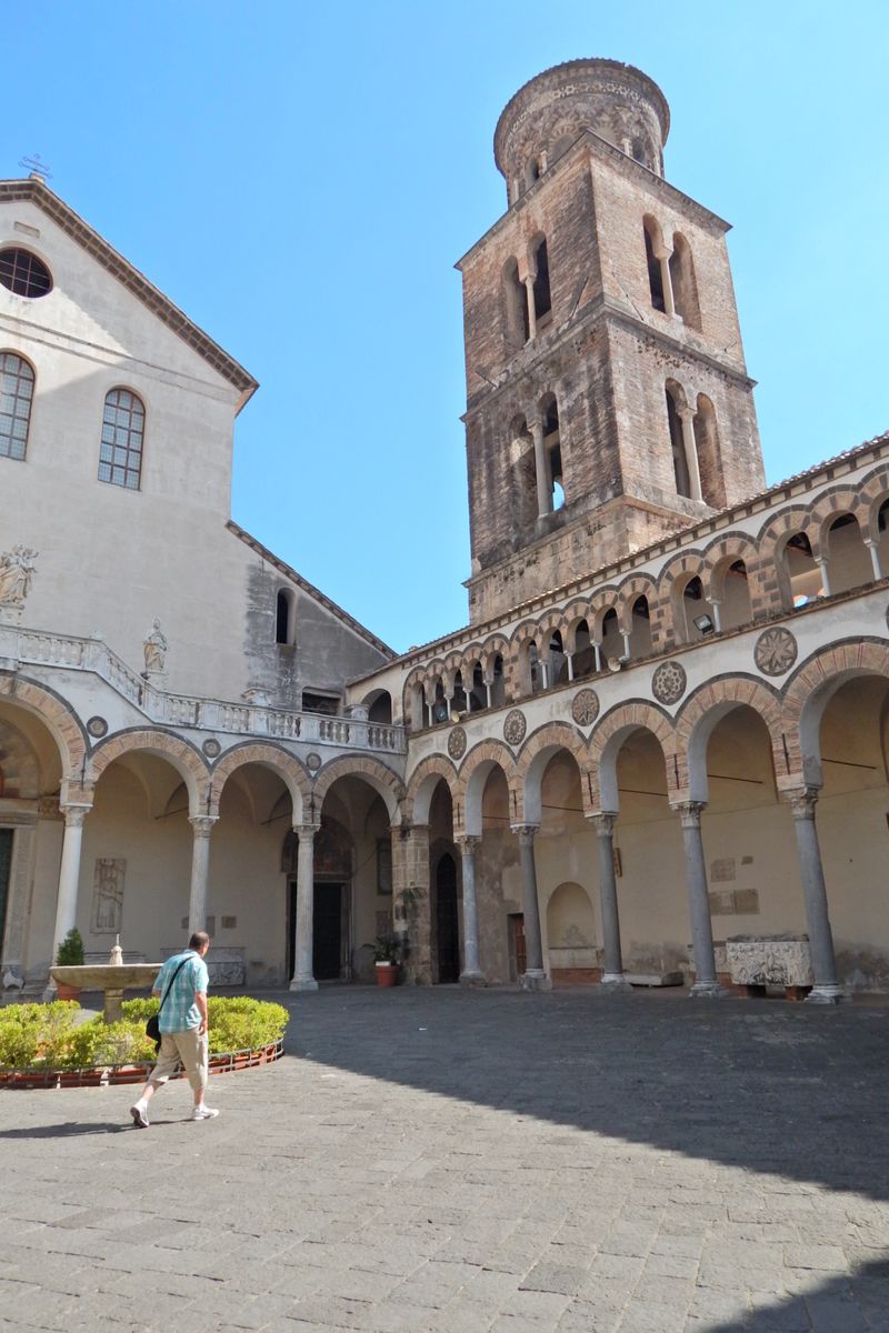 The stunning architecture of the Salerno Cathedral courtyard with its iconic bell tower.